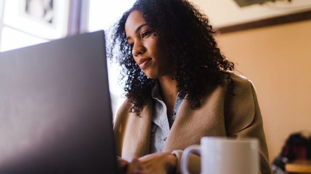 woman typing on a laptop