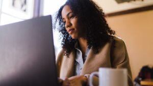 woman typing on a laptop